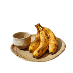 Rustic ceramic plate with three ripe bananas and a handmade ceramic cup,PNG, transparent background