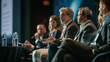 © VK Studio - Confident professionals participate in a discussion panel at a business conference.