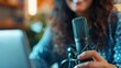 © LukaszDesign - Podcast, laptop, mic lady broadcasting, newscasting, or streaming in office. Business influencer, journalist, or radio speaker mic and virtual interview technologies