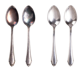 Tarnished and cleaned sterling silver spoons, isolated from above. On the left side two coffee spoons with dark layers of corrosion, and on the right side the same spoons after cleaning and polishing.