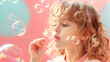 © Meekong.nk - Cheerful child blowing soap bubbles on a pastel background