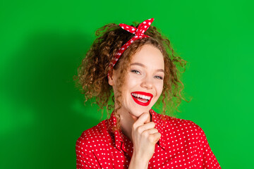 Poster - Photo portrait of lovely young lady minded cheerful smile dressed stylish red retro garment isolated on green color background