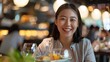 © Bijac - smiling asian woman enjoying a meal in a restaurant portrait capturing a joyful dining experience