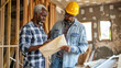 © Jirawatfoto - Collaborative Conversation: Entrepreneur and Construction Manager Discussing Renovation Plans
