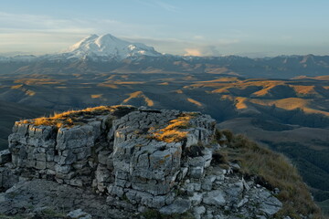 Wall Mural - Russia, the Elbrus region. Stunning sunrise on the rocks of the Bolshoy Bermamyt plateau against the background of Mount Elbrus.