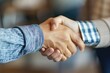 © Armir - A close-up shot of hands shaking during a business agreement, symbolizing a successful partnership.