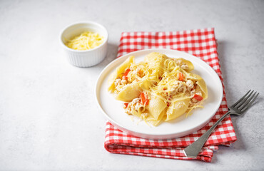 Wall Mural - Conchiglie pasta with minced chicken, red pepper and ricotta cheese in a plate