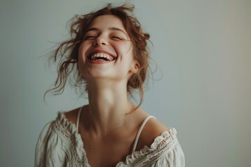 Wall Mural - Joyful woman laughing with eyes closed