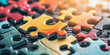 © IndigoElf - Closeup of multicolored Puzzle pieces. Abstract background, concept of logic, teamwork and problem solving