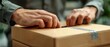 © Rona_65 - Closeup of hands removing items from a box, emphasizing logistics and shipping, copy space