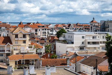 Walking in Arcachon, vacation destination town on Atlantic coast with beatiful parks, villas, streets and sandy beach, France