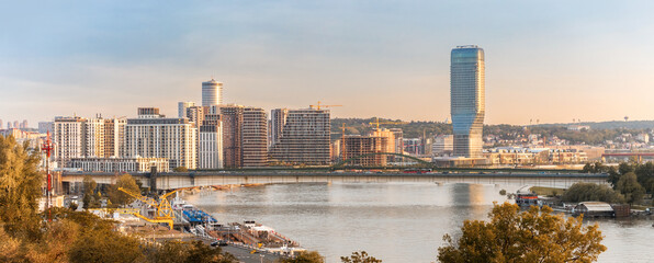 Wall Mural - at sunset, belgrade's downtown skyline, with its mix of towers and bridges, creates a stunning view 