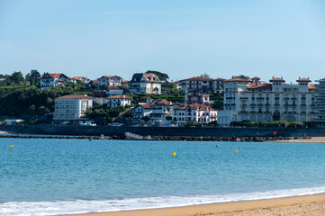 Beach, houses of Saint Jean de Luz on Basque coast, famous resort, known for beautiful architecture, nature and cuisine, South of France, Basque Country