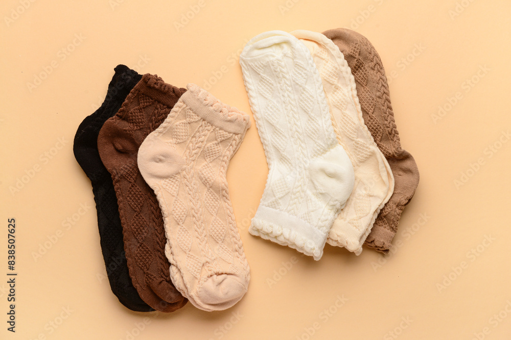 Different basic color socks on beige background