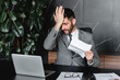© InsideCreativeHouse - Confused young businessman having financial problems with debts in office. Manager CEO having payment overdue, mortgage credit issues, being fired, failing with project and legacy