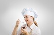 © BillionPhotos.com - Young beautiful woman chef cooking