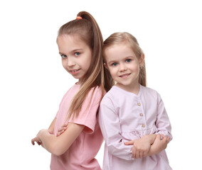 Canvas Print - Portrait of cute little sisters on white background