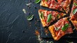 © julio - Slices of pizza with prosciutto and spices on black background, copy space, top view AI generated