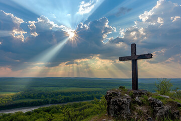 Sticker - A cross on a tranquil hill overlooking a vast landscape, with radiant sunrays streaming through the clouds, creating a scene of serenity and natural beauty.