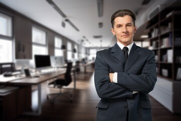 Wall Mural - Happy young businessman leader standing in office.