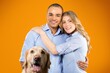 © BillionPhotos.com - Happy couple embracing their dog, lifestyle concept