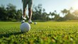© G.Go - A golf ball flying through the air, with a golfer watching the trajectory from the tee box