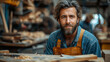 © VISUAL BACKGROUND - A man in a workshop with woodworking tools.