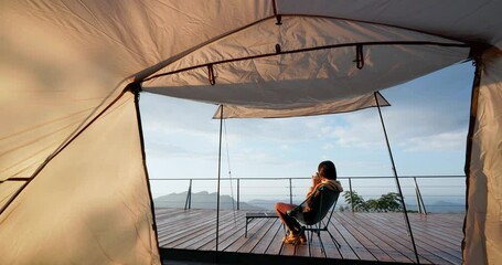 Wall Mural - Woman enjoy the drink beside the camping tent