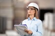 © BillionPhotos.com - business person with a clipboard at construction site