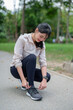 © Pichsakul - Young asian sporty women tying shoelaces running shoes to getting ready for run training and jogging fitness while workout and exercise for healthy wellness lifestyle in the morning at outdoor park
