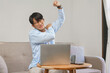 © Pichsakul - Home office, Businessman raising arm while exhausted and shoulders pain from office syndrome