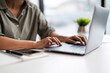 © Pichsakul - Asian casual businesswoman use laptop to working about growth finance report of new startup project