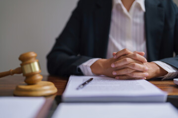 Lawyer woman work with concentration reading business contract about legal agreement in firm office