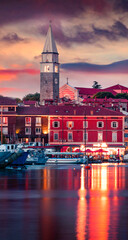 Wall Mural - Splendid sunset of old fishing town town Isola. Colorful spring evening on Adriatic Sea. Beautiful seascape of Slovenia. Traveling concept background. Artistic style post processed photo.