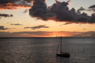 Wall Mural - an image of a boat on the ocean at sunset in a harbor