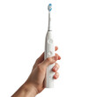 © ZeyBer - Hand Holding an Oral-B Electric Toothbrush on a Transparent Background
