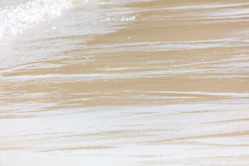 Wall Mural - White sand on the seashore as an abstract background. Texture