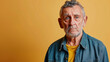 © Keitma - Portrait of an unhappy retired old man , yellow color background banner with copy space