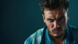© Keitma - Portrait of an unhappy young man , blue color background banner with copy space