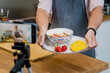 © romaset - The chef is broadcasting live from workshop how to prepare a vegetarian food