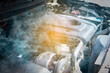 © Photo Sesaon - The car's engine has a problem. Car engine overheats and there was smoke causing damage to the engine.