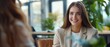 © Mickael - Happy young woman doing a job interview. Recruiter interviewing candidate at desk in office. professional business woman executive manager having job interview in meeting. Generative ai