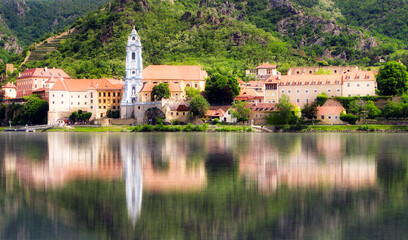 Wall Mural - Reflection in Danube of Durnstein town in Wachau valley in autumn, Austria