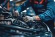 © ttonaorh - Close-up of a car repair service technician in a car repair station