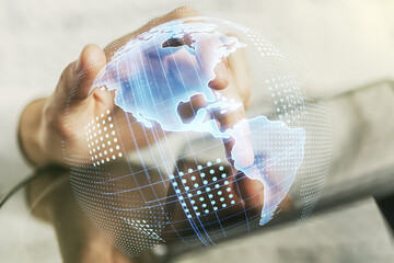 Wall Mural - digital america map and finger clicks on a digital tablet on background, international trading conce