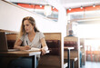 © Lyndon Stratford/peopleimages.com - Woman, serious and writing at cafe with laptop as university student for elearning or online education. Female learner, virtual and coffee shop for studying or revision and research for college exams