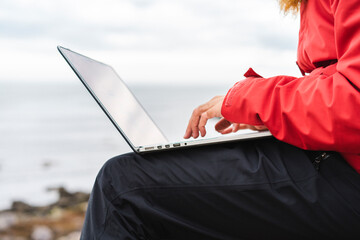 Poster - Iceland, North of Iceland, man using laptop outdoors, partial view