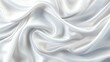 © Amina - Crumpled white silk cloth, gentle folds, shiny and smooth texture, elegant and luxurious, top view
