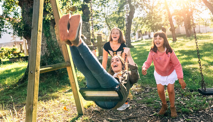 Three happy girls on a playground