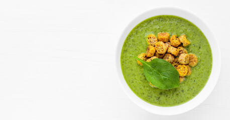 Wall Mural - Green soup. Broccoli spinach cream soup in a bowl. Food banner with copy space.